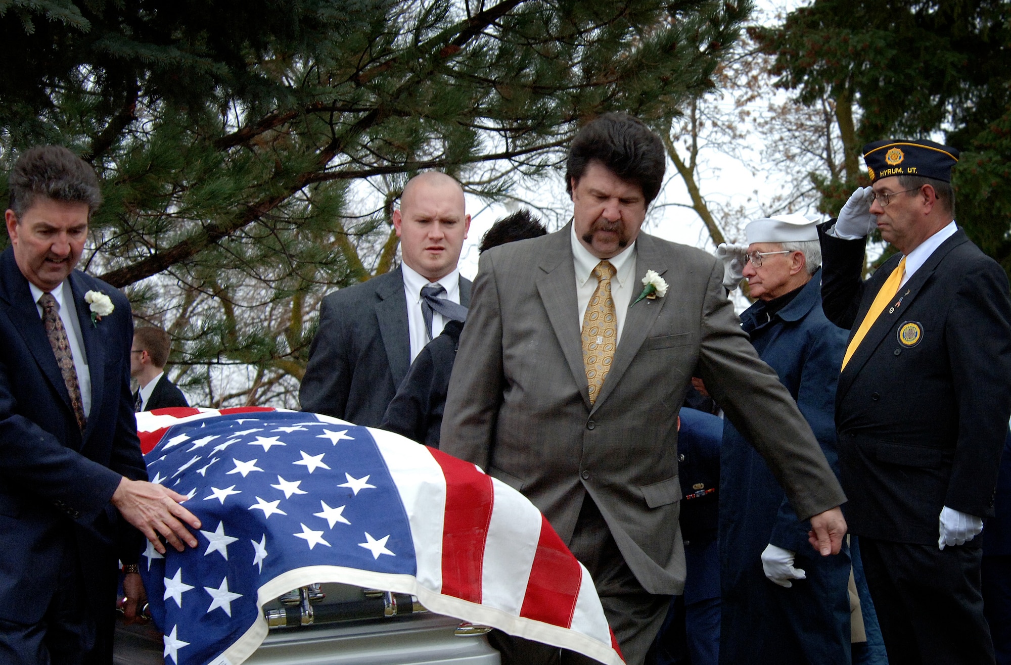 Nielsen family members carry the body of deceased Lt. Colonel Chase J. Nielsen to his final resting place in the city cemetery of Hyrum, Utah March 28. Colonel Nielsen was one of the few remaining members of the famed Doolittle Raiders. The members of the Doolittle Raiders reached national acclaim in 1942 after launching the first successful aerial bombing raid on Tokyo, Japan as retaliation for the Japanese bombing of Pearl Harbor, Hawaii in December of 1941. (U.S. Air Force photo/Efrain Gonzalez)