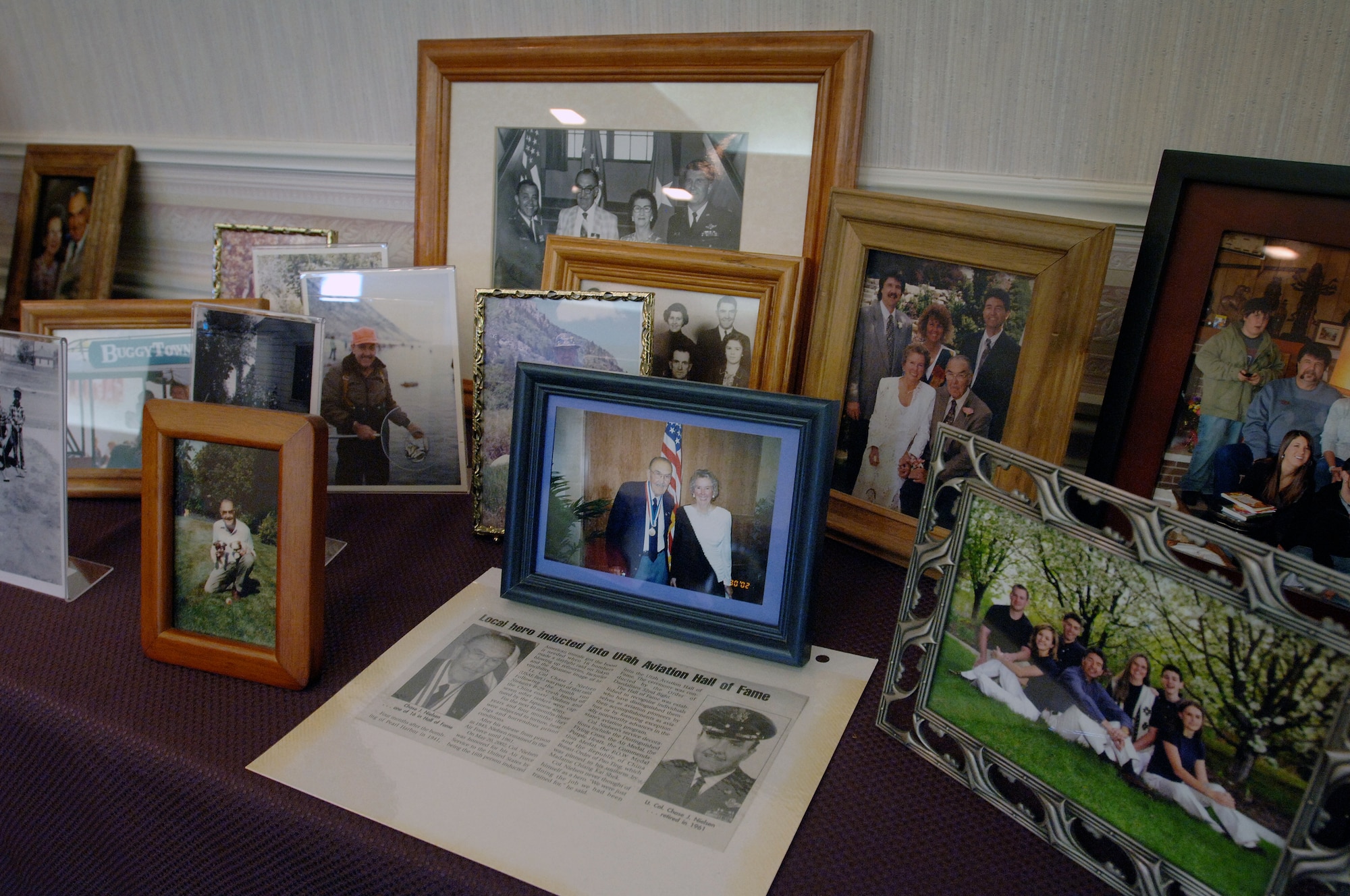 Family photos and other memorabilia adorn the chapel of the Allen-Hall Mortuary where family and friends attended Lt. Colonel Chase J. Nielsen memorial service in Hyrum, Utah March 28. Colonel Nielsen was one of the few remaining members of the famed Doolittle Raiders. The members of the Doolittle Raiders reached national acclaim in 1942 after launching the first successful aerial bombing raid on Tokyo, Japan as retaliation for the Japanese bombing of Pearl Harbor, Hawaii in December of 1941. (U.S. Air Force photo/Efrain Gonzalez)