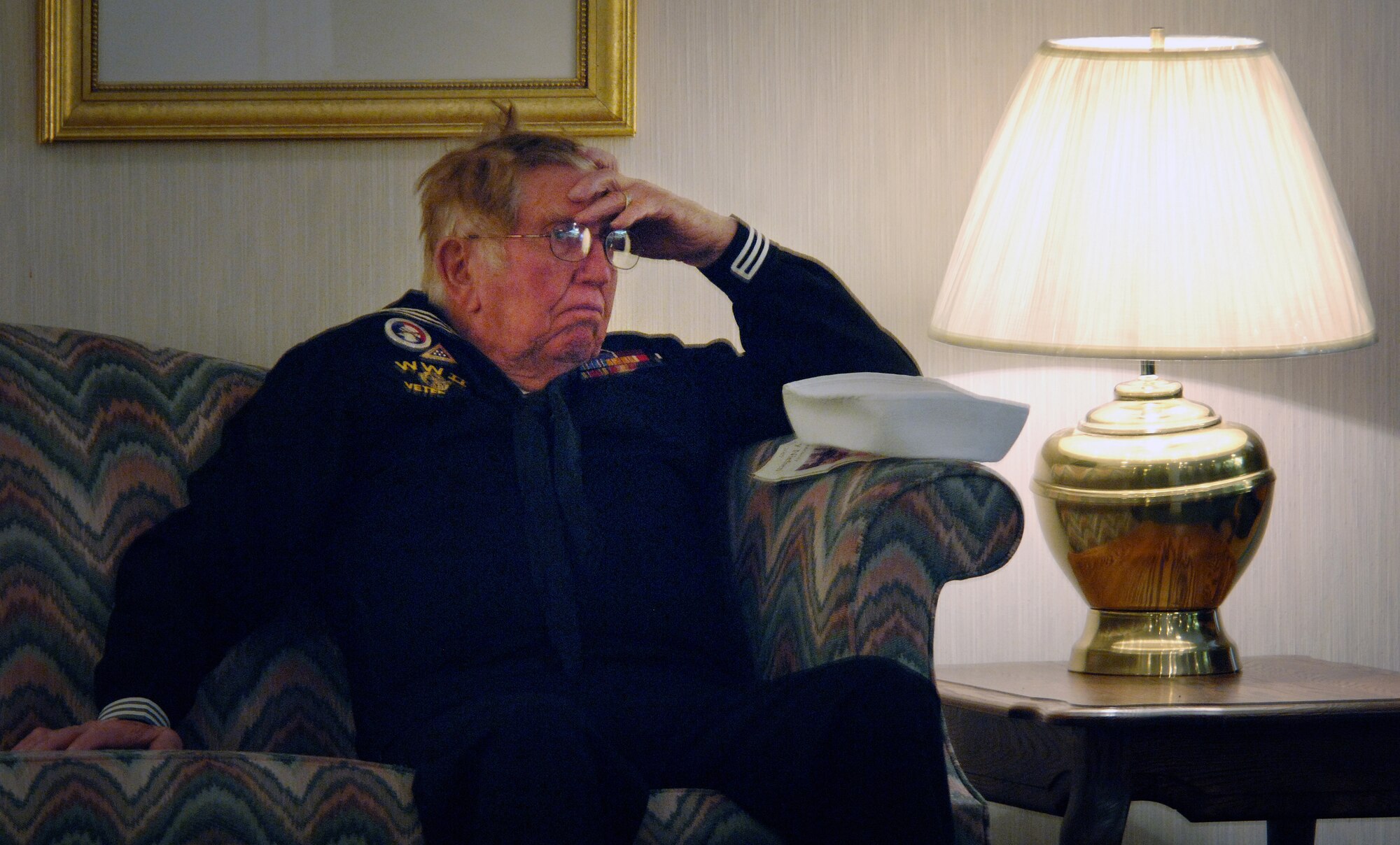 Willie Hunsaker, retired Navy SEABEE and member of the Veterans of Foreign War Post 1695 from Brigham City, Utah, mourns the loss of Lt. Colonel Chase J. Nielsen at his memorial service in Hyrum, Utah March 28. Colonel Nielsen, a long time member of VFW Post 1695 post, was more than a hero to the post's members. Colonel Nielsen was one of the few remaining members of the famed Doolittle Raiders. The members of the Doolittle Raiders reached national acclaim in 1942 after launching the first successful aerial bombing raid on Tokyo, Japan as retaliation for the Japanese bombing of Pearl Harbor, Hawaii in December of 1941. (U.S. Air Force photo/Efrain Gonzalez)