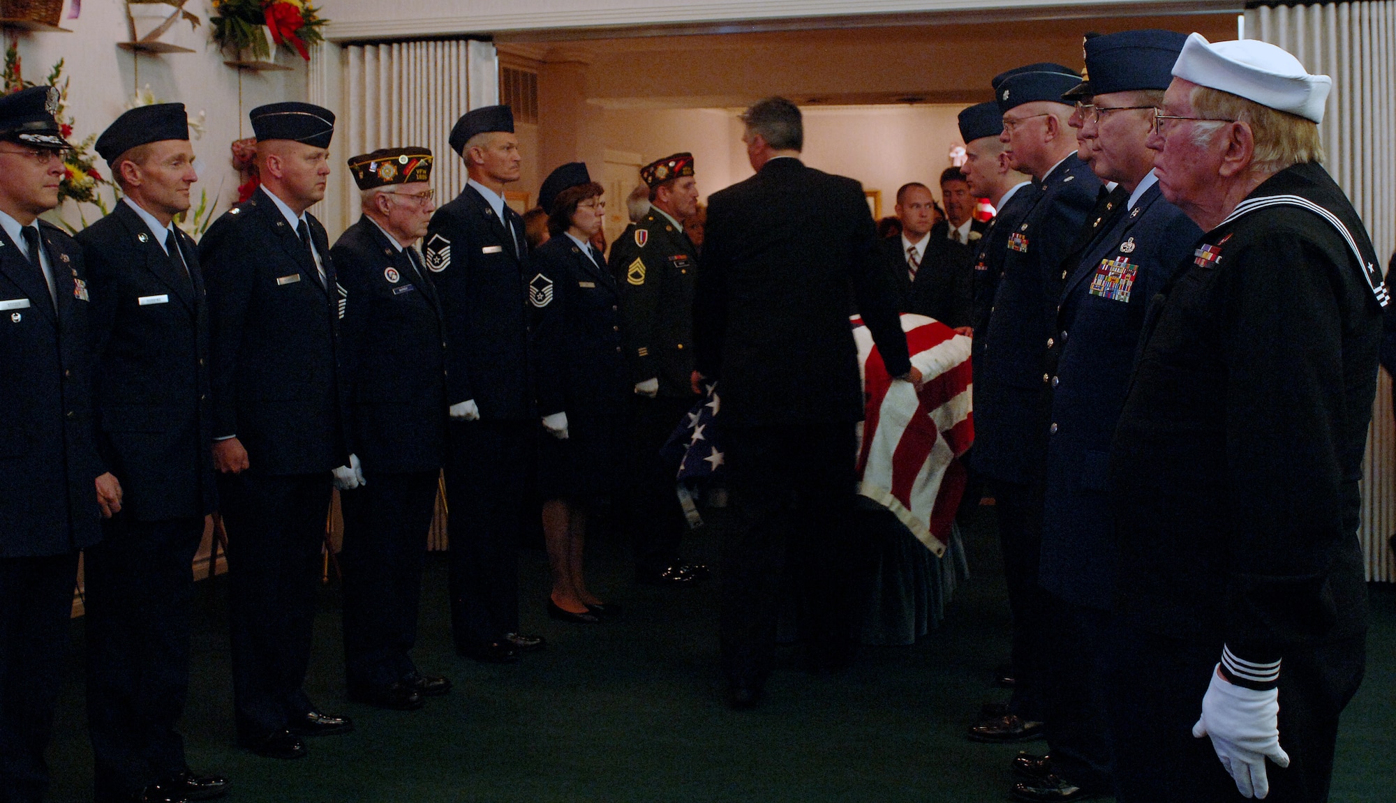 Veterans from Veterans of Foreign War Post 1695, Post 8307 and active duty military members pay their final respects at Lt. Colonel Chase J. Nielsen memorial service in Hyrum, Utah March 28. Colonel Nielsen was one of the few remaining members of the famed Doolittle Raiders. The members of the Doolittle Raiders reached national acclaim in 1942 after launching the first successful aerial bombing raid on Tokyo, Japan as retaliation for the Japanese bombing of Pearl Harbor, Hawaii in December of 1941. (U.S. Air Force photo/Efrain Gonzalez)