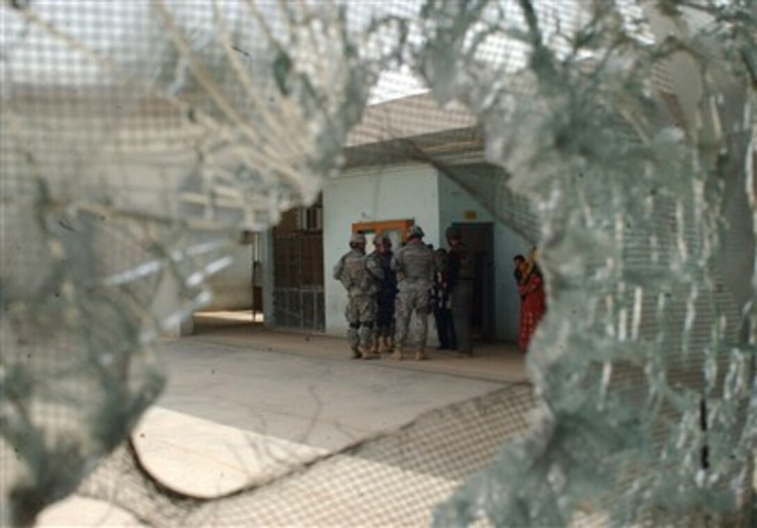 U.S. Army soldiers assigned to 3rd Brigade Combat Team, 1st Infantry Division, conduct a visit to a primary school in Adhamiya, Iraq, March 25, 2007, to assess the necessary repairs after it was damaged during a firefight earlier in the week.