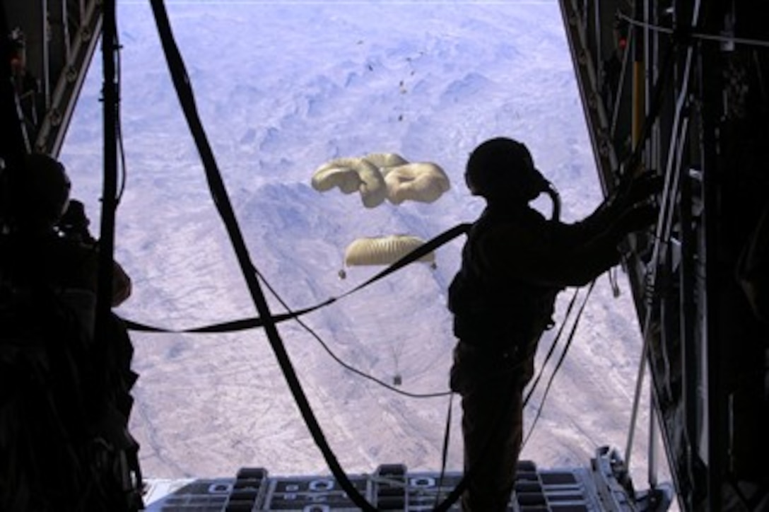 A U.S Air Force loadmaster secures the ramp of a C-130 Hercules after dropping critical supplies to replenish U.S. ground forces in Afghanistan on March 27, 2007.  The airdrops of supplies are necessary because of the rugged terrain the troops are working in.  