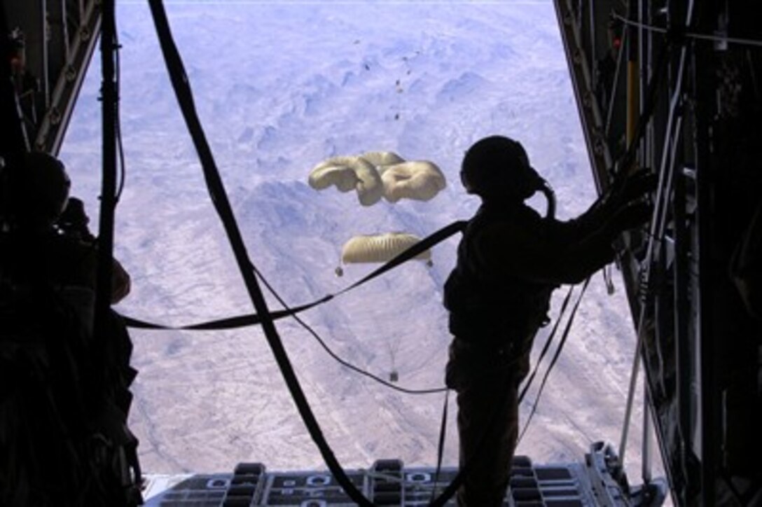 A U.S Air Force loadmaster secures the ramp of a C-130 Hercules after dropping critical supplies to replenish U.S. ground forces in Afghanistan on March 27, 2007.  The airdrops of supplies are necessary because of the rugged terrain the troops are working in.  
