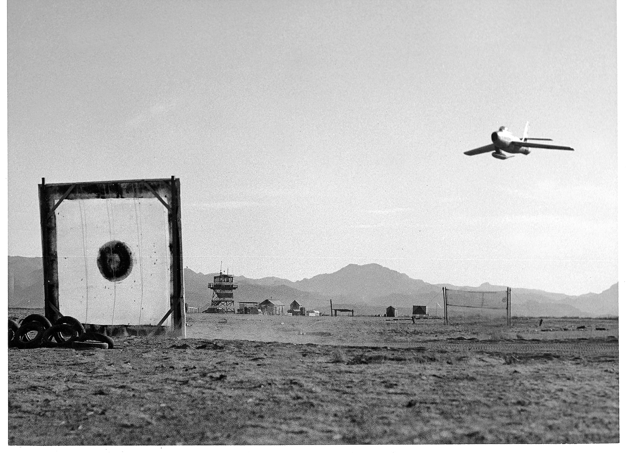 An Air Force F-86 conducts a strafing run to a target on what is now the Barry M. Goldwater range in the Arizona desert.  The F-86 was a plane used in the early to mid-1950s. (Courtesy photo)