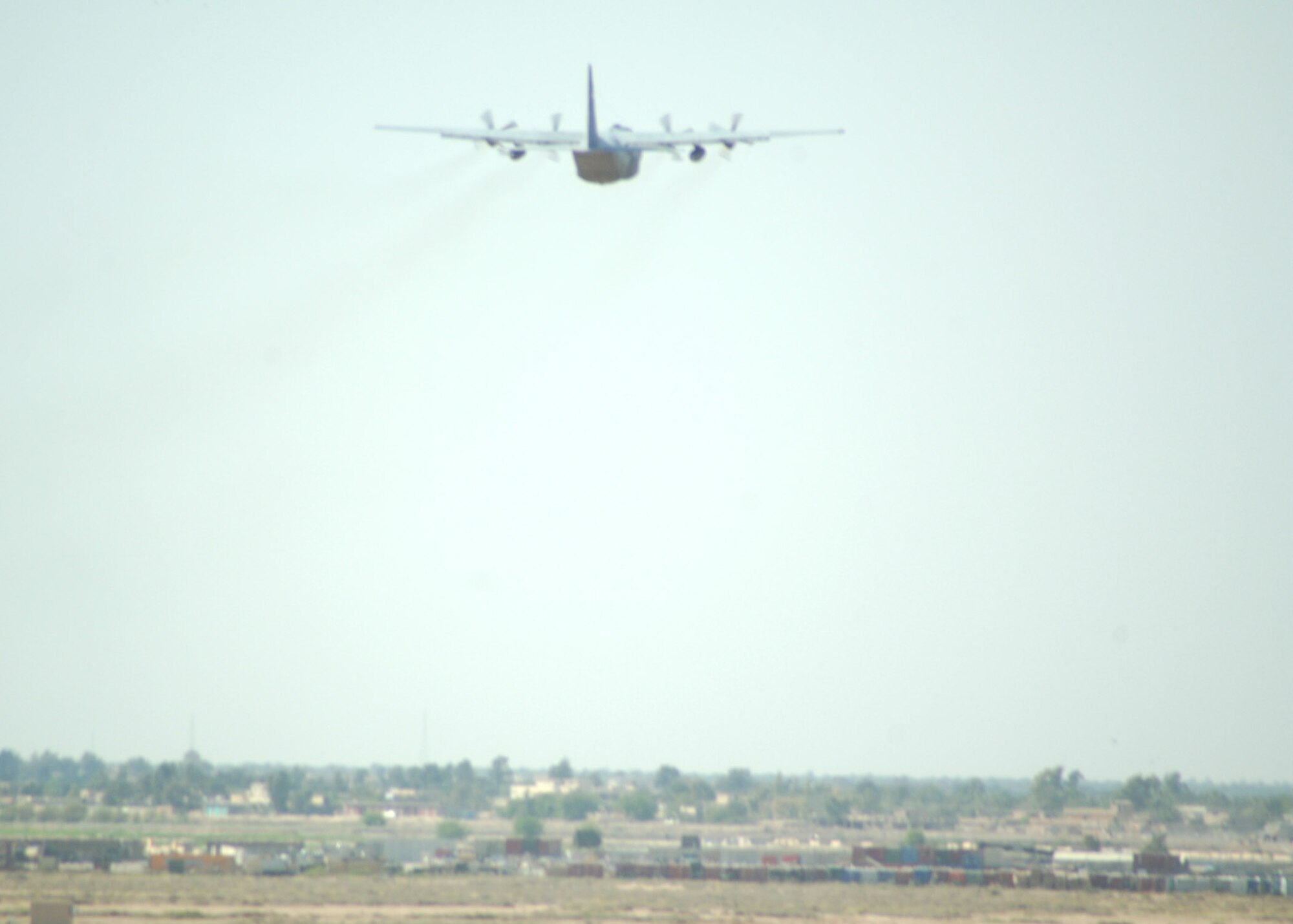 BALAD AIR BASE, Iraq - An Iraqi Air Force C-130 Hercules takes off from the airfield here with pallets of food, tents and other humanitarian relief supplies for delivery to Iraqis in the city of Tal Afar north of Mosul. Iraqi citizens in Tal Afar were victimized in an insurgent vehicle-borne improvised explosive device attack March 27 that killed 80, wounded 140 more and destroyed more than 20 homes. (U.S. Air Force photo/Capt. Ken Hall)