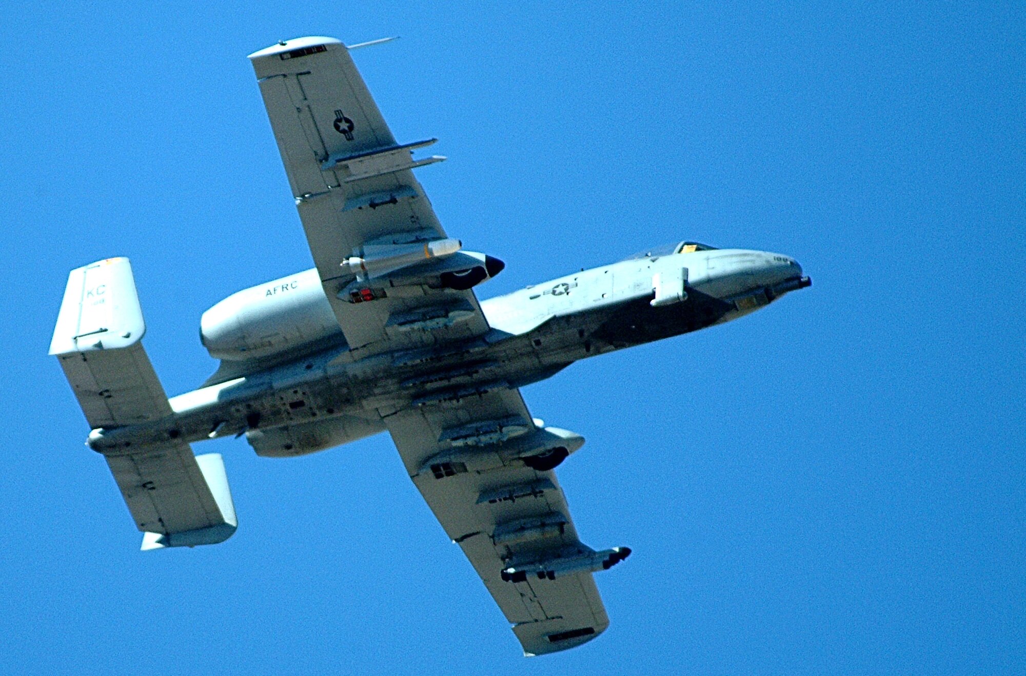 Its underside streaked with gunsmoke residue from its GAU-8, 30 millimeter, Avenger cannon, an Air Force Reserve Command A-10 Thunderbolt II from the 442nd Fighter Wing at Whiteman Air Force Base, Mo., passes over the Barry M. Goldwater Range, Ariz., during live ordnance training Feb. 26, 2007. After completing the pass, the pilot fired the live air-to-ground AGM-65 Maverick missile toward one of the range's many targets. (U.S. Air Force photo/Master Sgt. Bill Huntington)