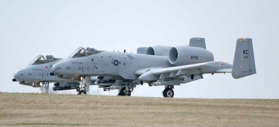 A two-ship formation of A-10 Thunderbolt IIs from the Air Force Reserve's 442nd Fighter Wing prepares for a takeoff roll from Whiteman Air Force Base, Mo., March 21, 2007, enroute to Cannon Range in central Missouri for a training sortie.  (U.S. Air Force photo/Maj. David Kurle)