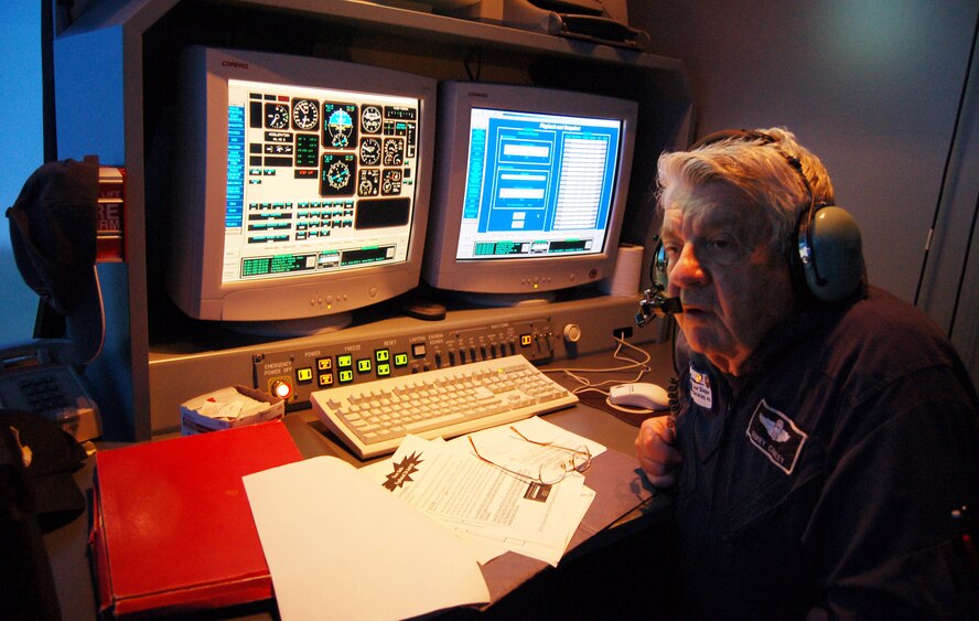 Retired Col. Terry Cawley, T-6A Simulator instructor for Lear Siegler Services, Inc., observes his last student March 16, at the T-6 flight simulator facility here. Colonel Cawley served 28 years in the Air force before becoming a T-6A simulator instructor. Moody’s last T-6A Texan Undergraduate Pilot Training course ended March 30. (U.S. Air Force photo by Tech.Sgt. Parker Gyokeres)