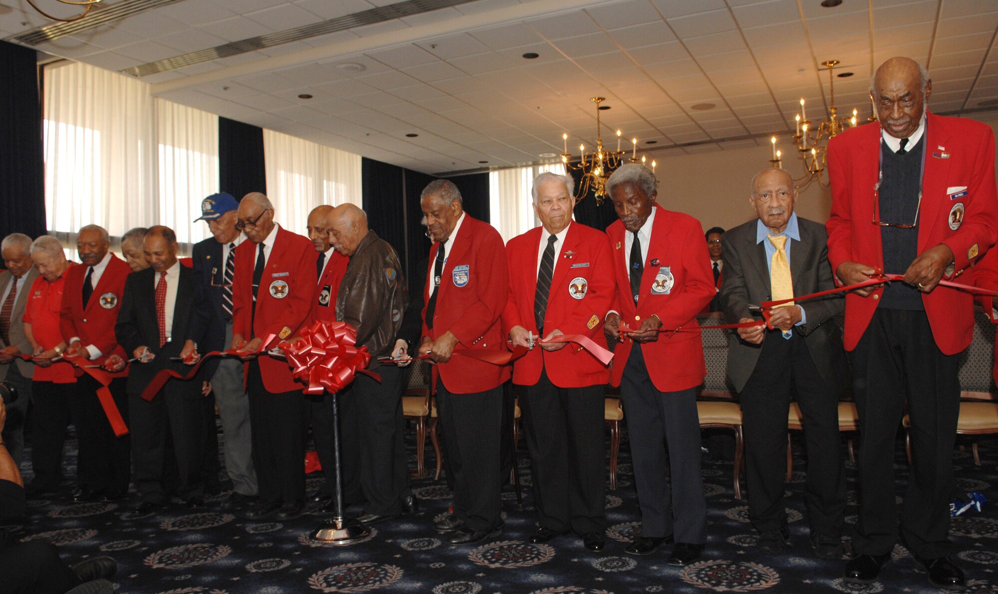 Original members of the Tuskegee Airmen cut the ribbon at the dedication ceremony of the "Tuskegee Room" at the Bolling Air Force Base Club in Washington, D.C., March 28. The Tuskegee Airmen received the Congressional Gold Medal from President George W. Bush March 29, the highest civilian honor bestowed by Congress. (U.S. Air Force photo/Airman 1st Class Timothy Chacon)