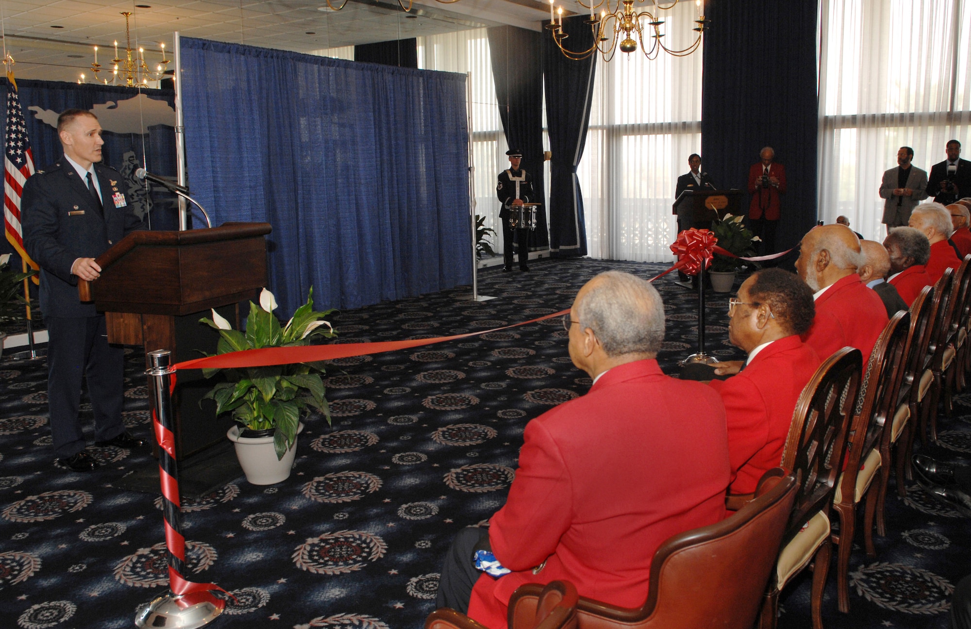 Col. Kurt Neubauer speaks to original members of the Tuskegee Airmen at the dedication ceremony March 28 of the "Tuskegee Room" at the Bolling Air Force Base Club in Washington D.C. The Tuskegee Airmen received the Congressional Gold Medal from President George W. Bush March 29, the highest civilian honor bestowed by Congress. Colonel Neubauer is commander of the 11th Wing. (U.S. Air Force photo/Airman 1st Class Timothy Chacon)