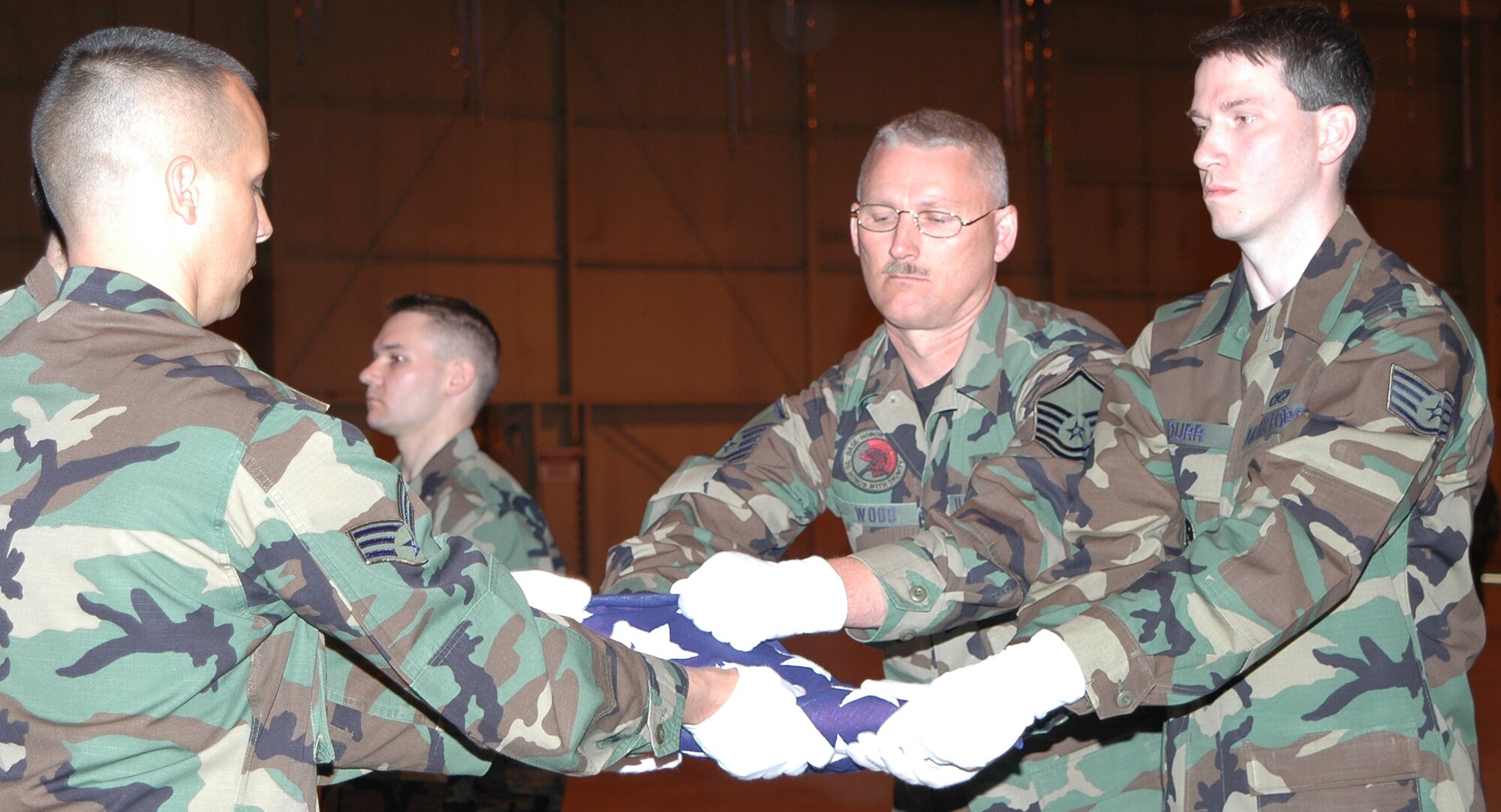 GRISSOM AIR RESERVE BASE, Ind., -- Members of the Grissom Honor Guard make the final folds on a flag during a mock funeral service that culminated their completion of Honor Guard training. Six new members were inducted into the Honor Guard on March 30. (U.S. Air Force photo/Tech. Sgt. Doug Hays)