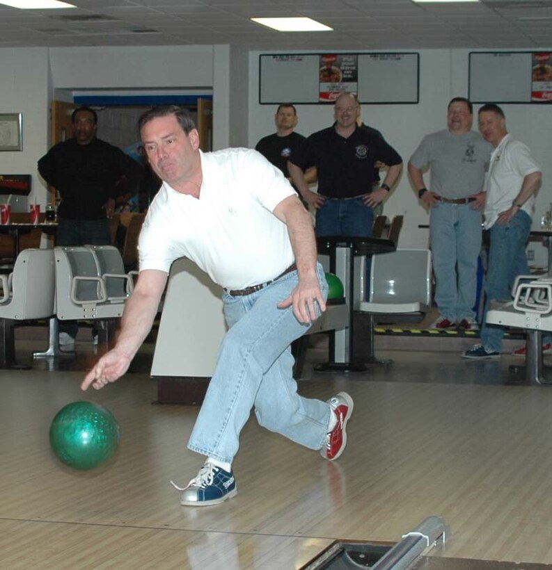 Col. Jeffry Smith, 28th Bomb Wing commander, participates in the Chiefs and Eagles Annual Bowling Tournament at Bandit Lanes March 27. Both sides talked a big game, but the colonels ended up winning the tournament with a bowling average of 144, beating the chiefs by an average of four pins. (U.S. Air Force photo/Airman Nathan Riley)