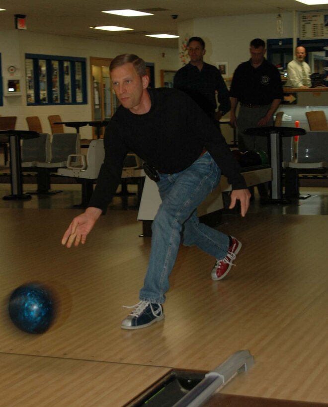 Chief Master Sgt. John Gillette, 28th Bomb Wing command chief, participates in the Chiefs and Eagles Annual Bowling Tournament at Bandit Lanes March 27. Both sides talked a big game, but the colonels ended up taking the trophy home with a bowling average of 144. This beat the chiefs average of 140 allowing the colonels to walk away victorious. (U.S. Air Force photo/Airman Nathan Riley)