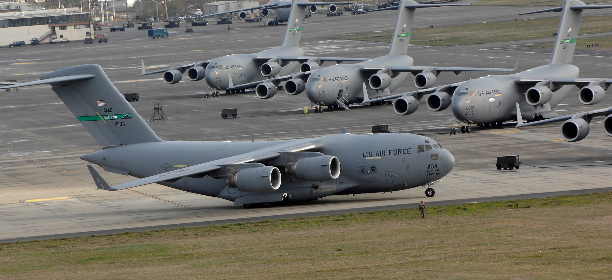 A C-17 Globemaster III prepares to launch on a local sortie as other C-17s are readied March 28 at McChord Air Force Base, Wash.  (U.S. Air Force photo/Abner Guzman)