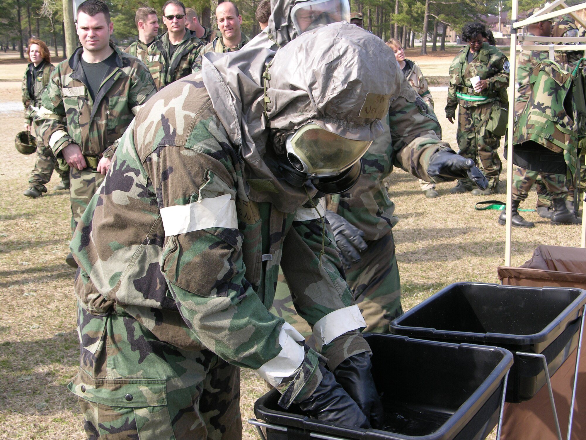 Part of unit training assembly weekend for members of the 916th Air Refueling Wing, Air Force Reserve, consists of learning how to survive and operate in a chemical environment. Airmen learn how to properly wear protective equipment and how to process through a decontamination center. (U.S. Air Force photo/Staff Sgt. Scott Mathews)   