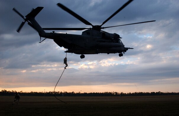 Special operations forces practice fast roping from an MH-53 Pave Low of the 20th Special Operations Squadron at Hurlburt Field Fla. Air Force Special Operations Command dominated the 2006 Air Force safety award program, garnering the service's top awards for best major command safety record, most effective MAJCOM-level flight safety program, and best ground safety program. (U.S. Air Force photo/Chief Master Sgt. Gary Emery) 