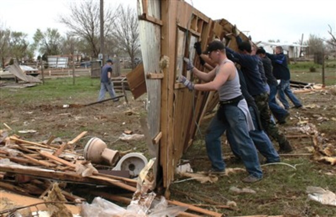 More than 500 airmen from Cannon Air Force Base have assisted Clovis, N.M., residents in storm cleanup. A tornado hit the town, located six miles east of the base, March 23 leaving homes, property and businesses in ruin. Airmen will continue to assist in clean up efforts on an individual basis. 