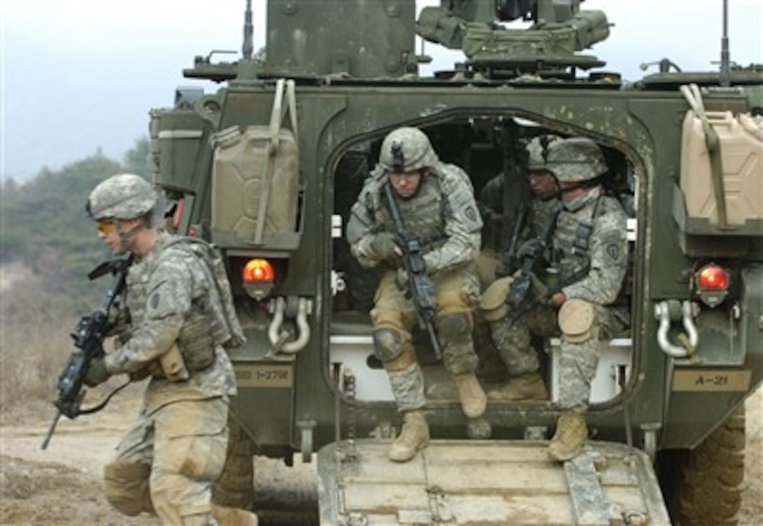 U.S. Army soldiers from Alpha Company, 1st Battalion, 27th Infantry Regiment, 2nd Stryker Brigade Combat Team exit their M1126 Stryker Infantry Carrier Vehicle during dismounted maneuvers at Warrior Valley on Rodriguez Range Complex, South Korea, on March 24, 2007, as part of exercise Foal Eagle 2007.  The annual joint command post and field training exercise improves combat readiness and joint and combined interoperability.  