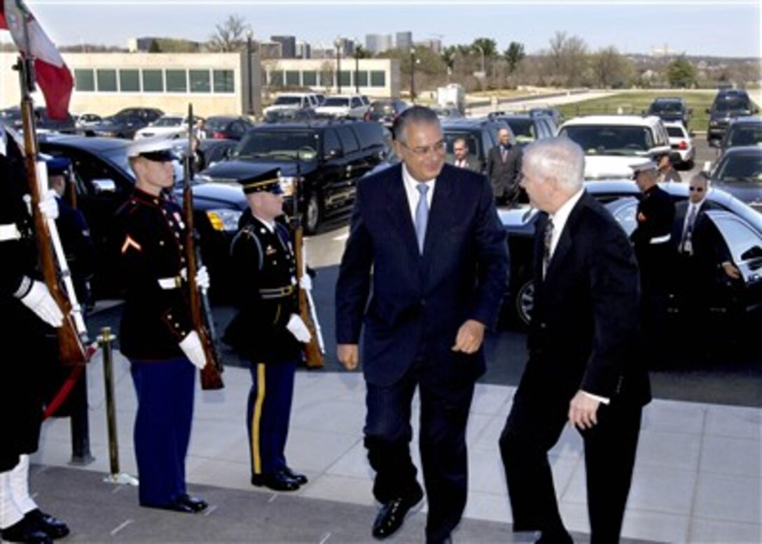 Secretary of Defense Robert M. Gates (right) talks with Peruvian Minister of Defense Allan Wagner (left) as they walk through an honor cordon and into the Pentagon on March 29, 2007.  Gates and Wagner will hold bilateral security discussions on a variety of global and regional issues of interest to both governments.  
