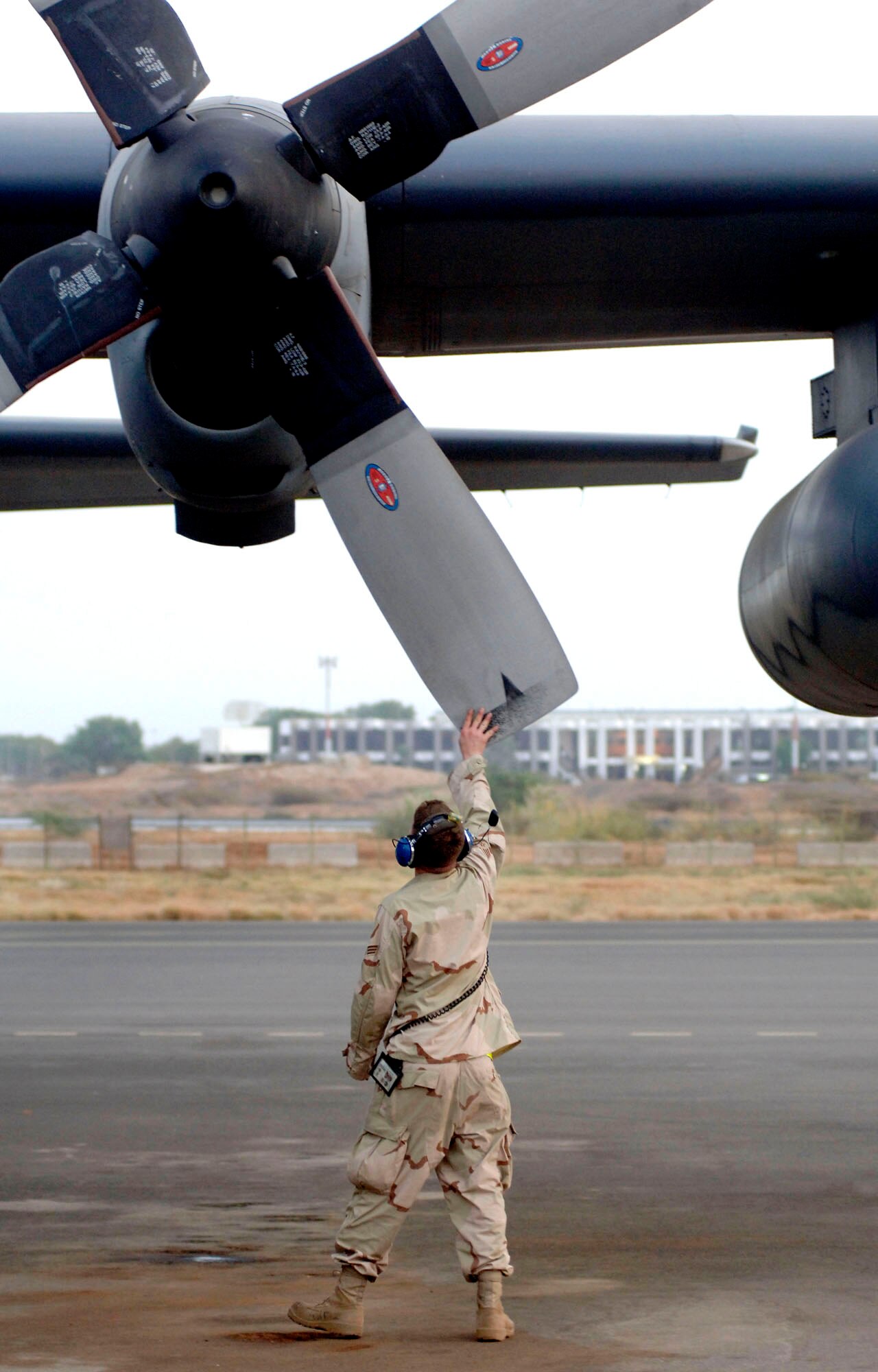 Senior Airman Dwight Madero checks the propellers on an HC-130P prior to take off from Camp Lemonier air field in Djibouti, Africa. The Air Force contingency at Camp Lemonier has almost 200 Airmen who support the Combined Joint Task Force-Horn of Africa mission. Airman Madero is assigned to the 71st Expeditionary Rescue Squadron. (U.S. Air Force photo/Daren Reehl) 