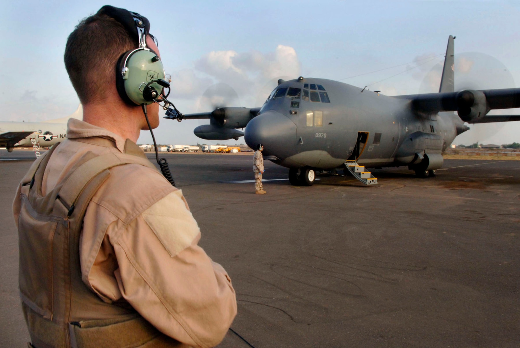Senior Airman Mark Victor prepares an HC-130P for take off March 28 at Camp Lemonier, Djibouti, Africa, during a recent mission. Since May of 2003, Camp Lemonier has been the staging area for the combined joint task force that has built numerous schools, clinics and hospitals. The task force has also accomplished dozens of medical and dental exercises and humanitarian assistance missions.  Airman Victor is a loadmaster deployed from the 39th Rescue Squadron at Patrick Air Force Base, Fla. (U.S. Air Force photo/Daren Reehl)