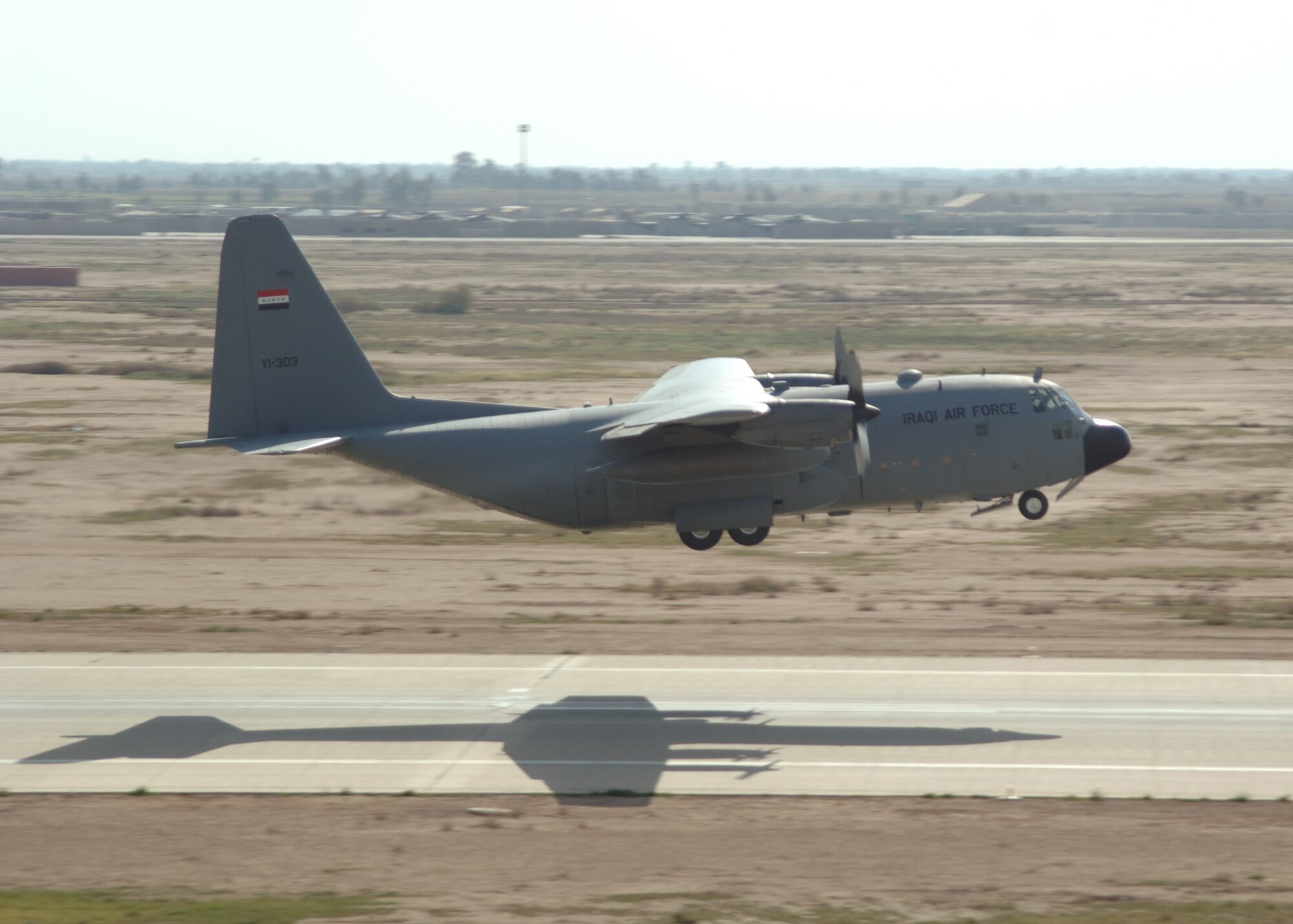 BALAD AIR BASE, Iraq - An Iraqi Air Force C-130 Hercules takes off from the airfield here with pallets of food, tents and other humanitarian relief supplies for delivery to Iraqis in the city of Tal Afar north of Mosul. Iraqi citizens in Tal Afar were victimized in insurgent vehicle-borne improvised explosive device attacks March 27 that killed 80, wounded 140 more and destroyed more than 20 homes. (U.S. Air Force photo/Capt. Ken Hall)