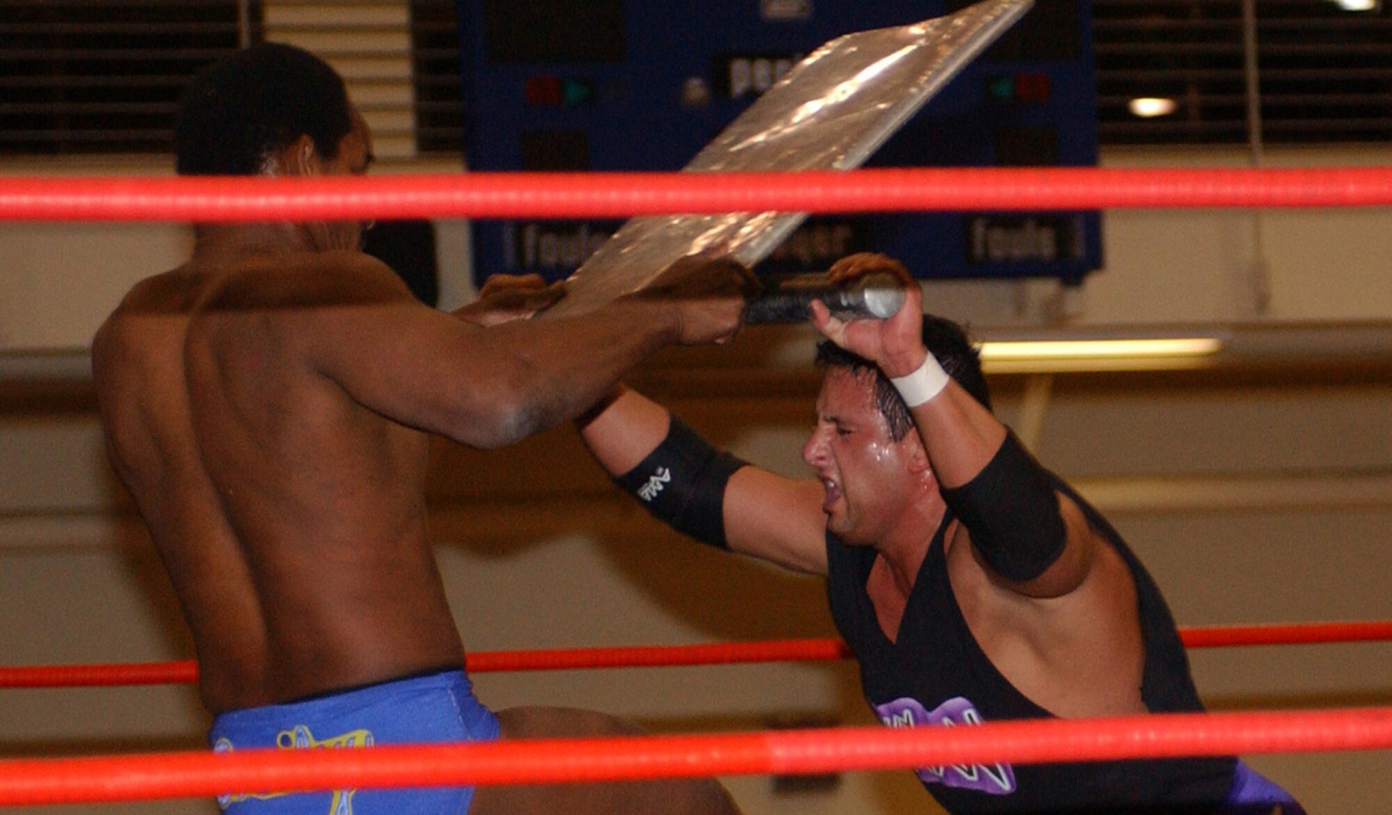 KUNSAN AIR BASE, Republic of Korea  April 29, 2007 -- International Championship Wrestling star Billy Kidman (right) battles back against Norman Smiley April 29 at the base fitness and sports center. The ICW's 2007 Pacific Invasion tour, sponsored by Armed Forces Entertainment, took the wrestling group to other United States Forces Korea installations, including Chinhae Naval Base, Camp Humphries, Osan Air Base and Camp Red Cloud. The wrestling tour ran from April 12 through May 1.                               