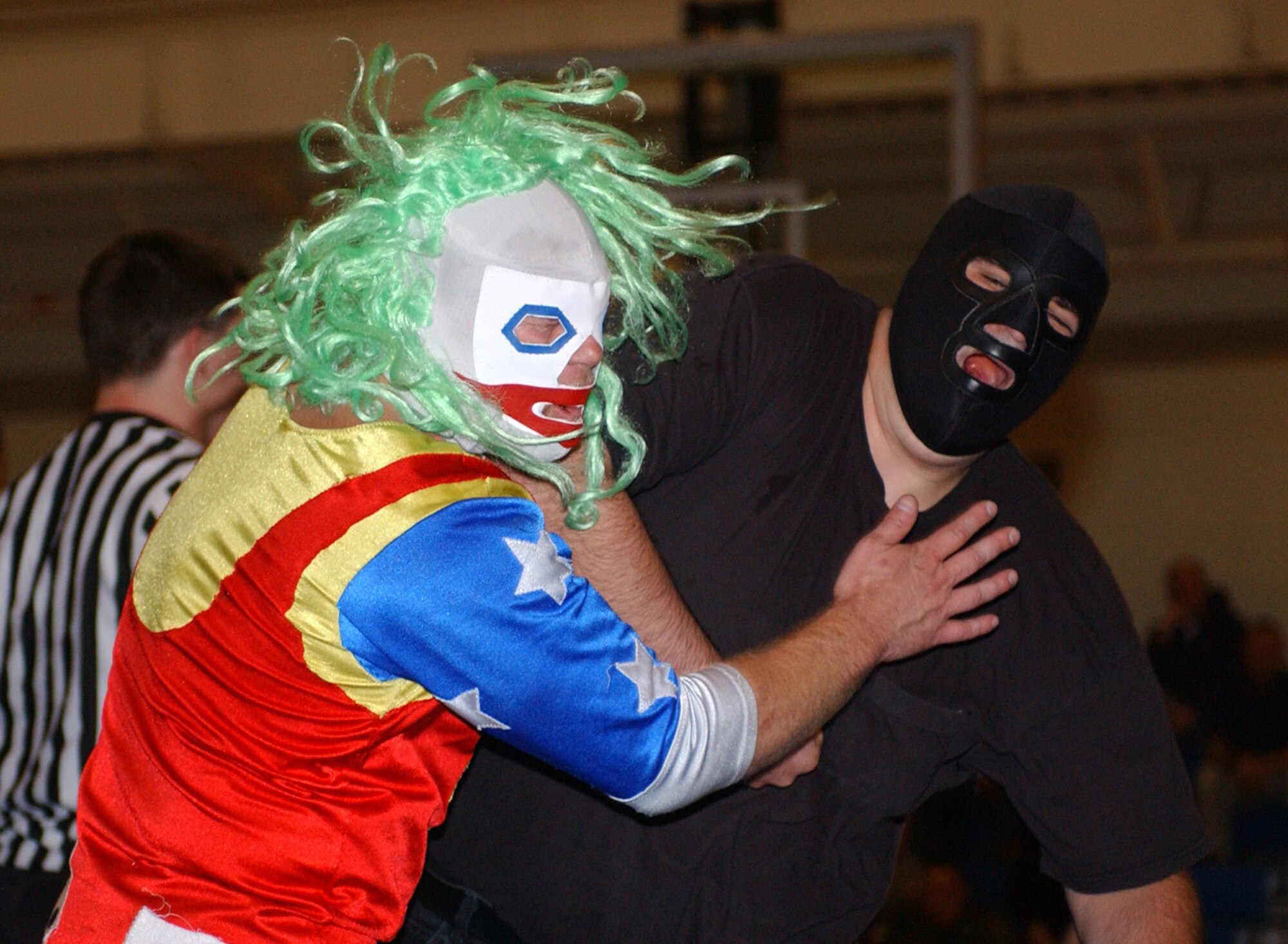 KUNSAN AIR BASE, Republic of Korea  April 29, 2007 -- Wrestler Mike James (right) slams Doink the Clown during their International Championship Wrestling heavyweight fight April 29 at the base fitness and sports center. Mr. Smiley is part of the ICW's 2007 Pacific Invasion tour, sponsored by Armed Forces Entertainment, which took the wrestling group to other United States Forces Korea installations, including Chinhae Naval Base, Camp Humphries, Osan Air Base and Camp Red Cloud. The wrestling tour ran from April 12 through May 1.          