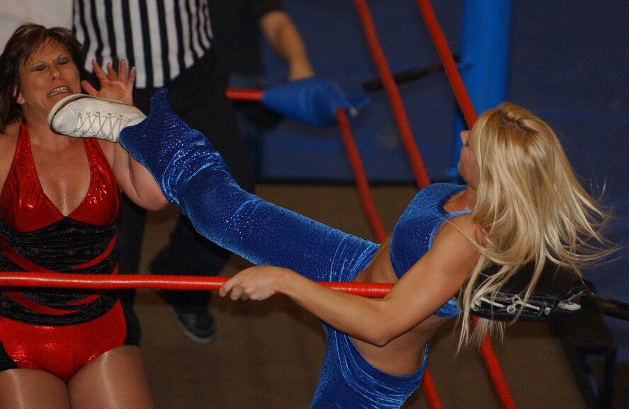 KUNSAN AIR BASE, Republic of Korea  April 29, 2007 --  International Championship Wrestling wrestler Erica D'Erico lays her foot into the unsuspecting chin of Lexie Fyfe April 29 at the base fitness and sports center. The ICW's 2007 Pacific Invasion tour, sponsored by Armed Forces Entertainment, took the wrestling group to other United States Forces Korea installations, including Chinhae Naval Base, Camp Humphries, Osan Air Base and Camp Red Cloud. The wrestling tour ran from April 12 through May 1.                               