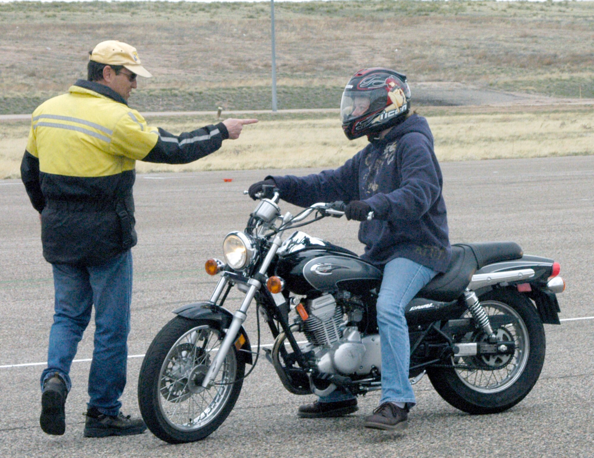 Gary Widup, Wyoming Department of Transportation, instructs a beginner motorcycle rider during motorcycle safety foundation training April 17 at the skid pad here. This training is required for all Warren Airmen wanting to ride their motorcycle on or off base. For class dates, call Tony Janssen at 773-1842 (Photo by 2nd Lt. Lisa Meiman).