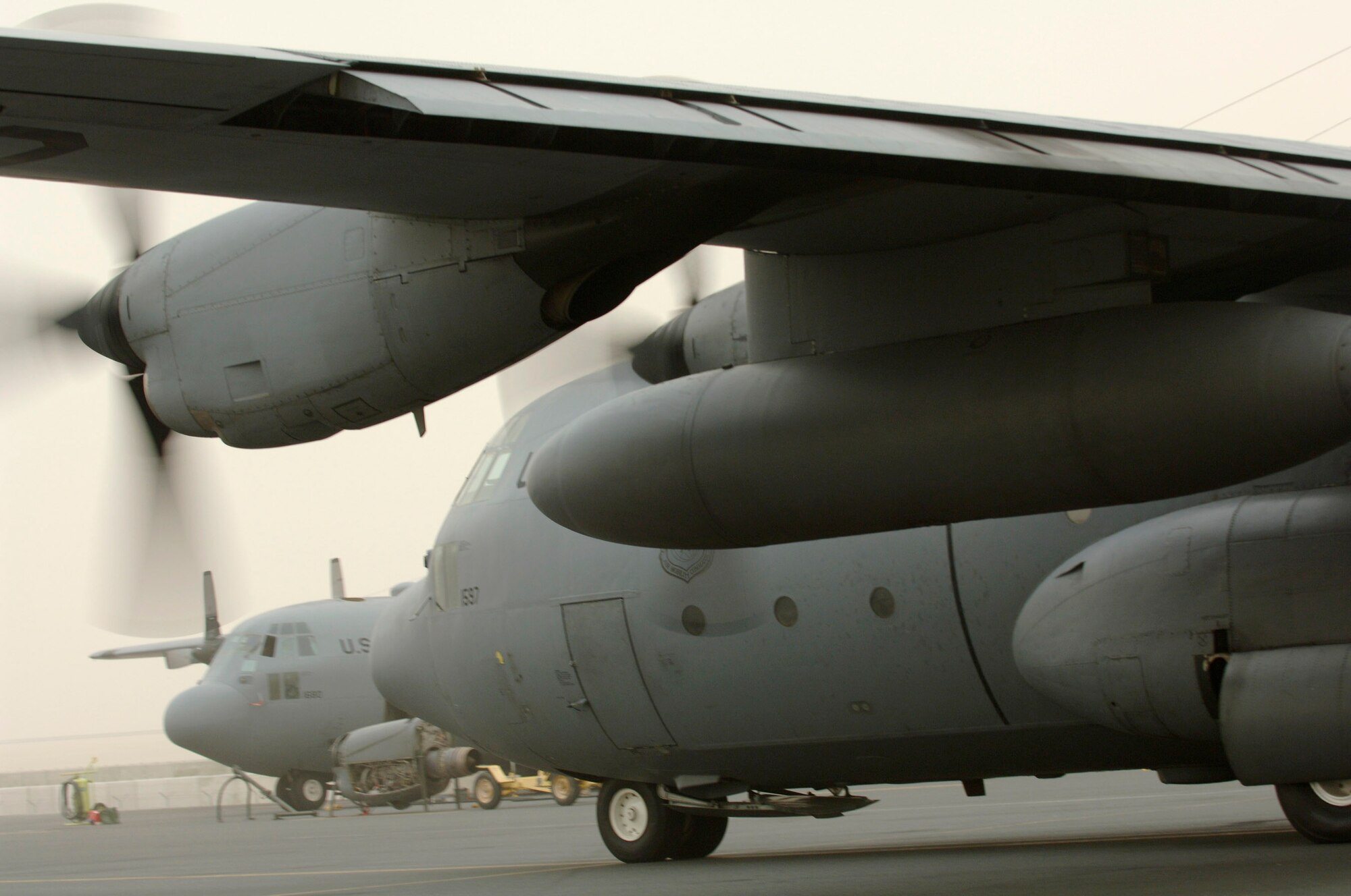A C-130 Hercules prepares for takeoff at an air base in Southwest Asia in support of operations in Iraq. The flexible design of the C-130 enables it to be configured for many different missions, allowing for one aircraft to perform the role of many. Much of the special mission equipment added to the C-130 is removable, allowing the aircraft to revert back to its cargo delivery role if desired. (U.S. Air Force photo)
