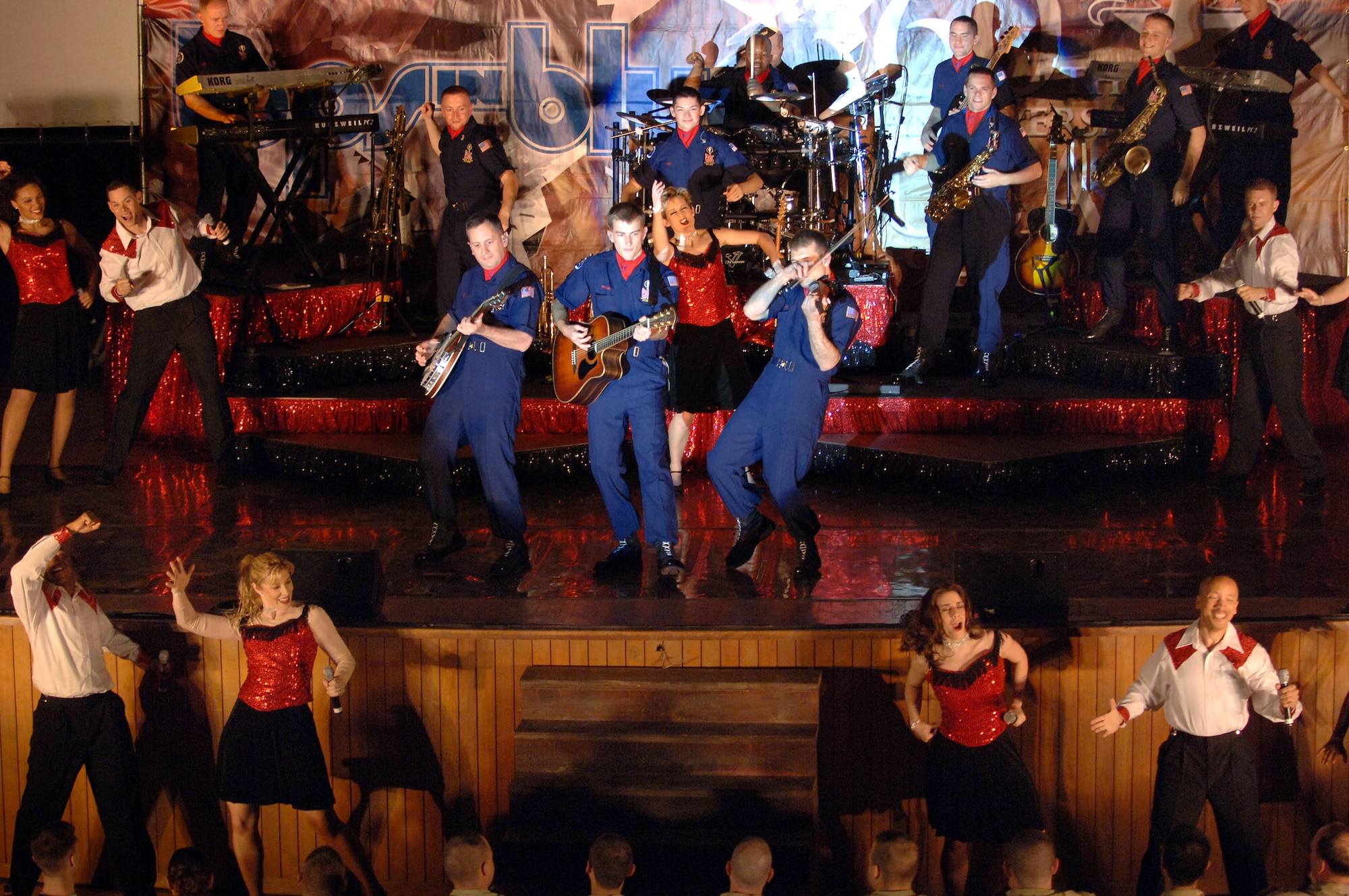 Members of Tops In Blue 2007 perform for servicemembers during a performance April 28 at Balad Air Base, Iraq. Thirty eight active-duty Airmen with the Air Force's premier expeditionary entertainers set out in mid-April to kick off their 2007 tour singing and dancing their way through the area of responsibility. They will tour Southwest Asia for three weeks, and continue their 2007 tour through February 2008. (U.S. Air Force photo/Staff Sgt. Michael R. Holzworth) 