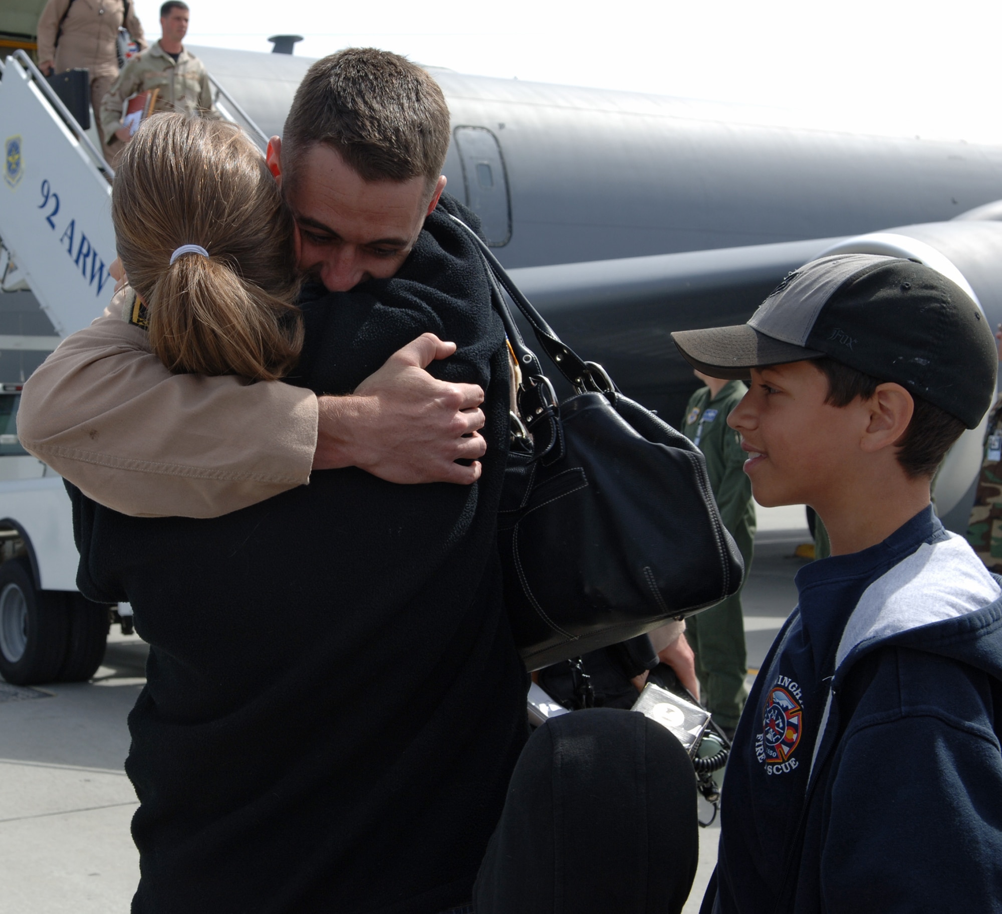 FAIRCHILD AIR FORCE BASE, Wash. – Capt. Brendan Voitik embraces his wife, Amy, just minutes after disembarking a KC-135. Captain Voitik returned with approximately 40 other deployers from Manas Air Base, Kyrgyzstan. (U.S. Air Force Photo/Airman 1st Class Jocelyn Ford)

