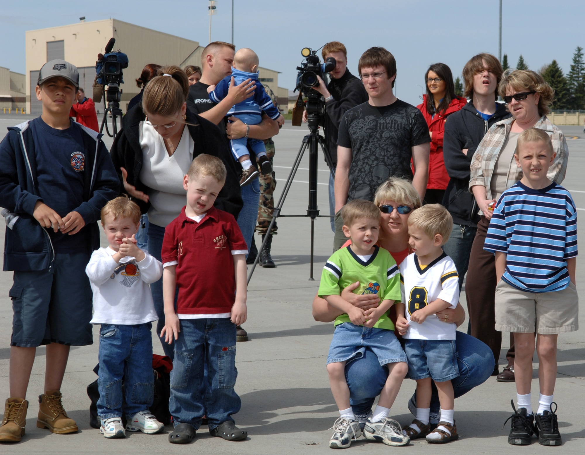 FAIRCHILD AIR FORCE BASE, Wash. -- Family, friends, and media wait for members of the 92nd Air Refueling Wing to disembark a KC-135. Approximately 40 members returned April 30 after their deployment to Manas Air Base, Kyrgyzstan. (U.S. Air Force Photo/Airman 1st Class Jocelyn Ford)
