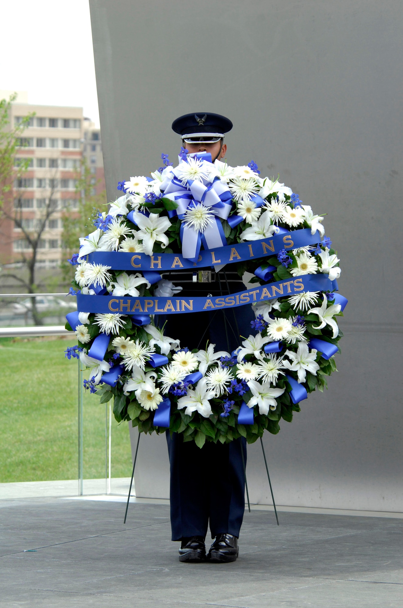 Airman 1st Class Kirk Campbell holds a wreath April 25 while waiting for a special ceremony to start at the Air Force Memorial in Arlington, Va., to honor chaplains and chaplain's assistants.  (U.S. Air Force photo/Tech. Sgt. Cohen A. Young) 