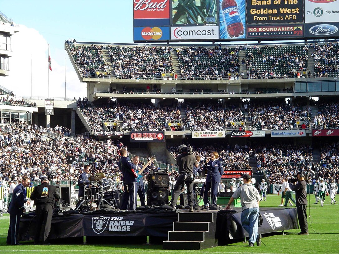 Mobility popular music combo performs patriotic music selections before the Oakland Raiders football game at McAfee Coliseum for over 40,000 sports fans on 9 November, 2003