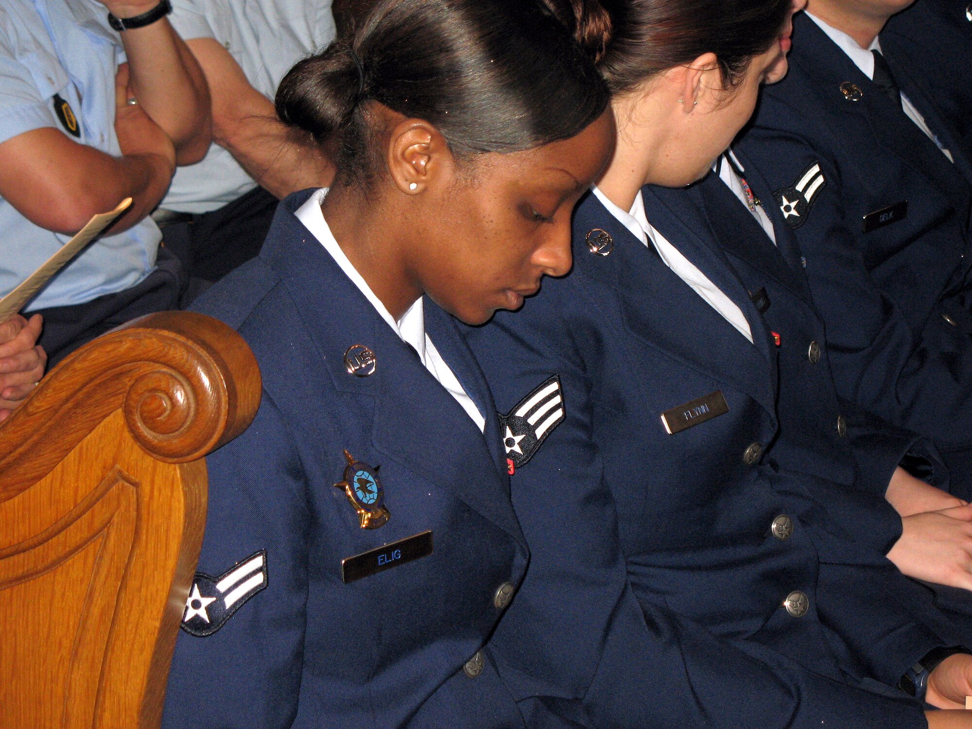 Airman 1st Class Erika Elig observes the World Day of Peace in a cathedral in Trier, Germany. Every year, the festival - dedicated to prayer and services focused on healing the rifts between cultures - is held in Germany's oldest city. (U.S. Air Force photo/Airman 1st Class Bradley Kasch)