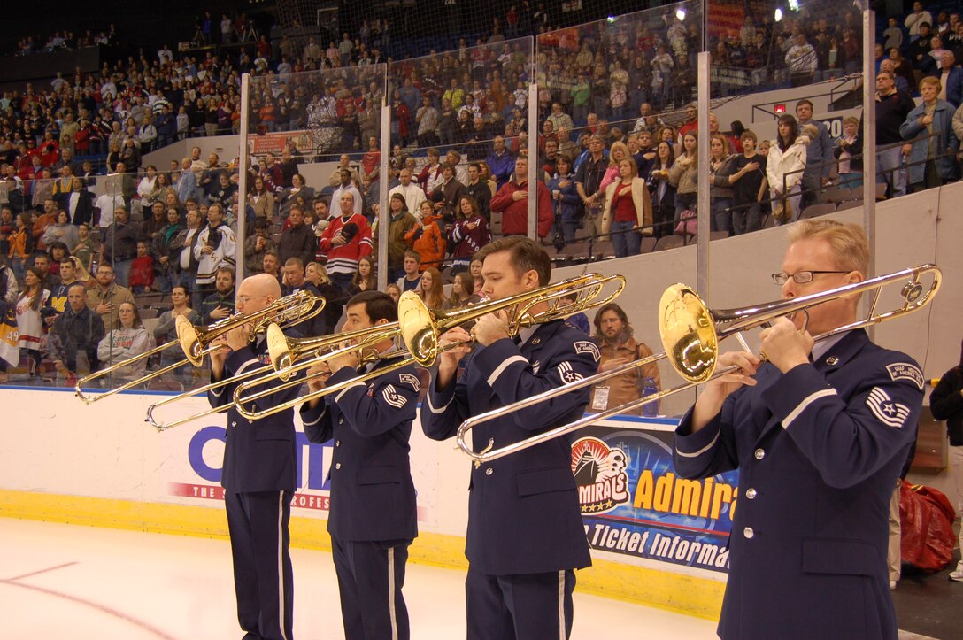 The USAF Heritage of America Band Cirrus Trombone Quartet performs the Star Spangled Banner for 4,000 hockey fans at the Scope for the Norfolk Admirals match on March 9, 2007.