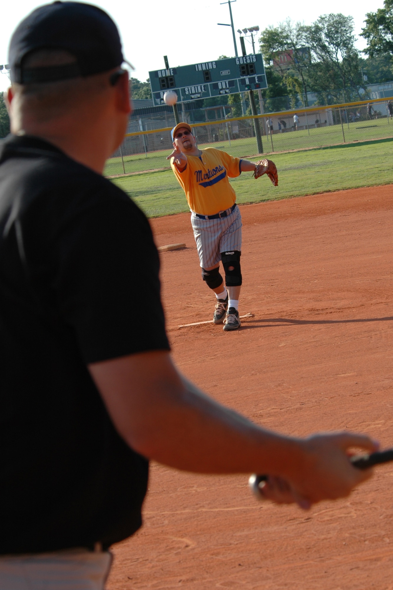 EGLIN AIR FORCE BASE, Fla. -- Neil Orness, Air Force Research Laboratory pitcher, delivers the first pitch of the 2007 intramural softball season to Brent Batten, 796th Civil Engineer Squadron, April 30. The AFRL blasted past their opponent 18-5. The intramural league consists of 26 teams spread among two leagues. Each team will play 12 games throughout the season to earn a position in the postseason playoffs scheduled for later this summer.  (U.S. Air Force photo by Staff Sgt. Mike Meares)