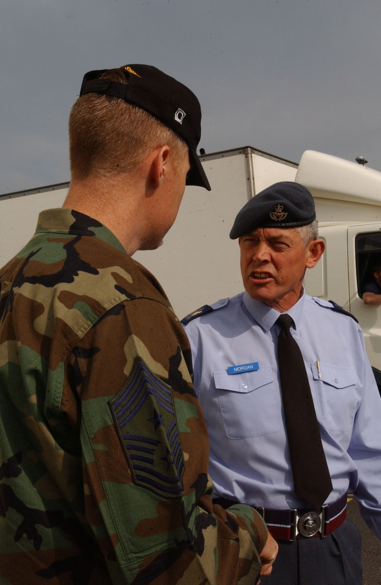 RAF Mildenhall Command Chief Master Sgt. Michael Warner, left, welcomes Warrant Officer Lindsey Morgan from the Royal Air Force for his tour of RAF Mildenhall Air Force Base, April 23, 2007. (U.S Air Force photo by Airman Brad Smith)                                