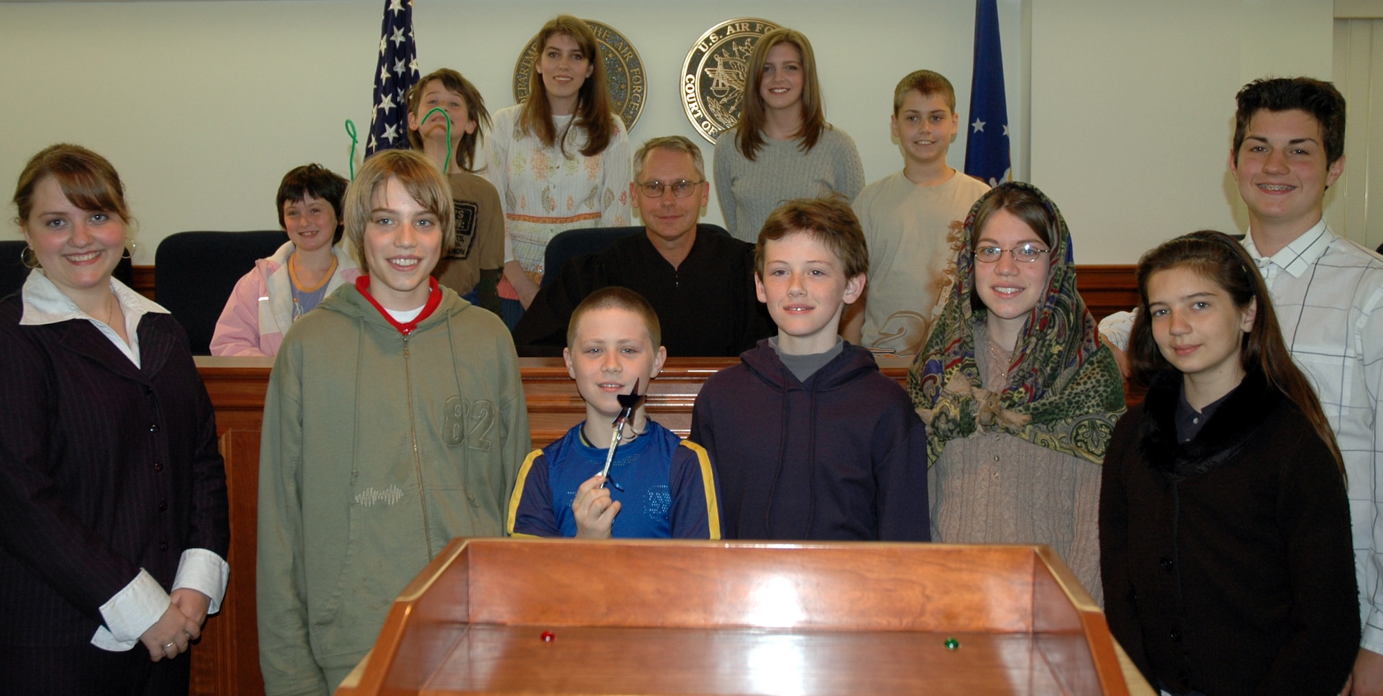 Bolling area homeschoolers pose with Col. Steve Thompson, Air Force appellate judge, after a mock trial at the Air Force Court of Criminal Appeals April 27. (U.S. AIr Force photo by Airman 1st Class R. Michael Longoria) 