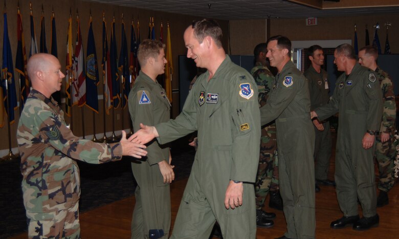 A group of Airmen who recently returned from deployment were welcomed home Monday night at the Columbus Club.  In this photo, senior leaders from CAFB shake hands and say a few words to each returning Airman.  