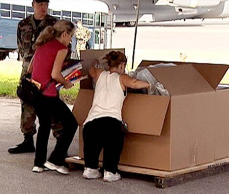 First Lieutenant Robert O'Day stands guard as Amazing Race contestants Charla and Mirna take part in an Air Force humanitarian relief effort by filling a box with 500 pounds of essential supplies for locals on neighboring islands. Once their box reaches 500 pounds of supplies the cousins will board a massive C-17 cargo plane for an opportunity to experience an official Air Force airdrop exercise.
Photos courtesy of CBS Amazing Race