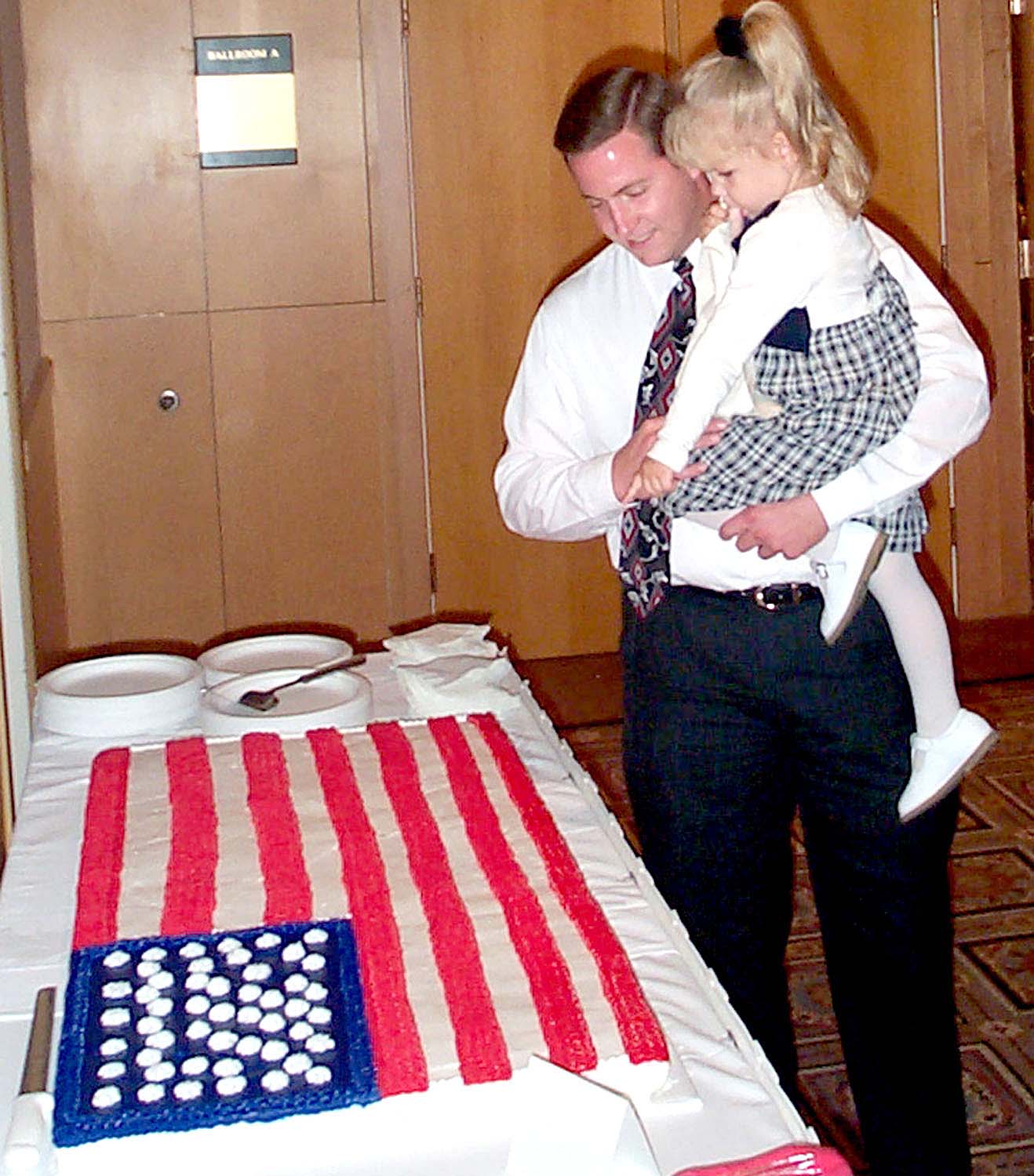 Wesley A. Babcock shows his niece, Kaitlyn Rowenhorst, 3, the huge