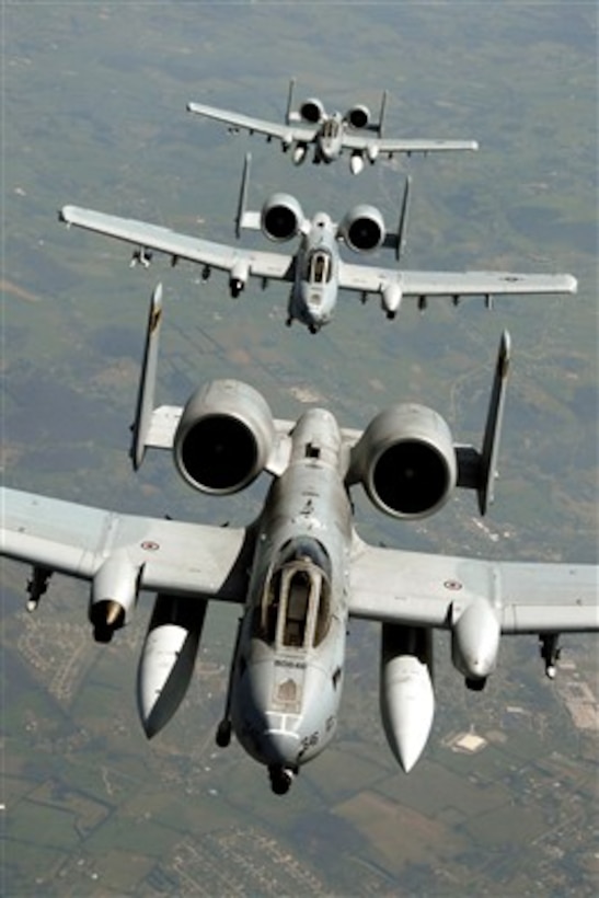 Three A-10 Thunderbolts from the 103rd Fighter Wing, Connecticut Air National Guard, trail behind a KC-135R Stratotanker on April 10, 2007.  The aircraft are traveling across the country to their new home with the 188th Fighter Wing at Fort Smith, Ark., as part of the Base Realignment and Closure reorganization.  