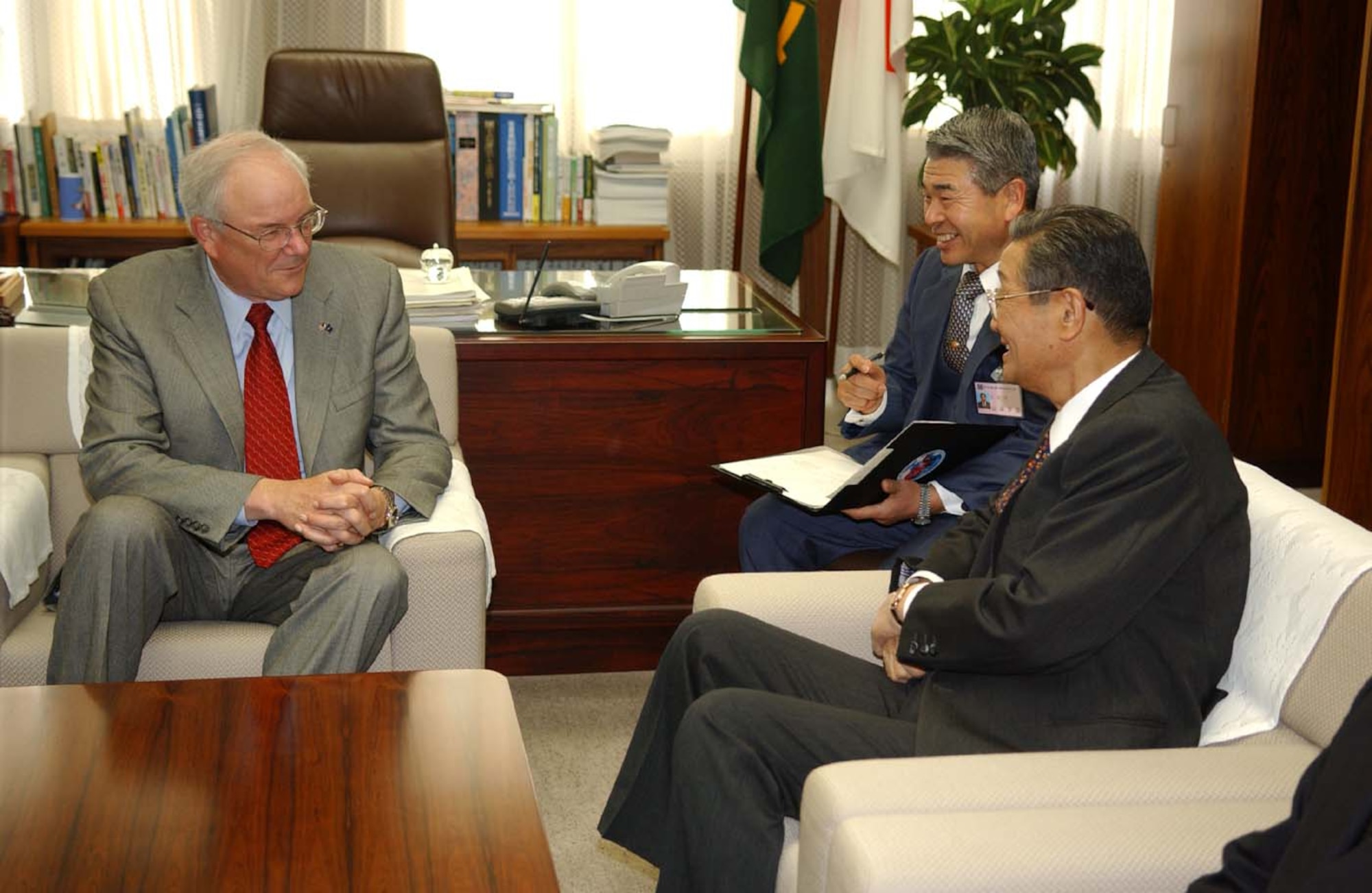 060325-F-1467B-003 MISAWA AIR BASE, JAPAN - The 060325 -- MISAWA AIR BASE, Japan -- Honorable Michael W. Wynne, Secretary of the Air Force (left) speaks with Misawa City Mayor Shigeyoshi Suzuki (right) during his visit to Misawa Air Base, Japan on March 25, 2005. Secretary Wynne spoke on issues involving joint efforts with the Japanese and American Air Forces. (U.S. Air Force photo by Tech. Sgt. Andy Bellamy)