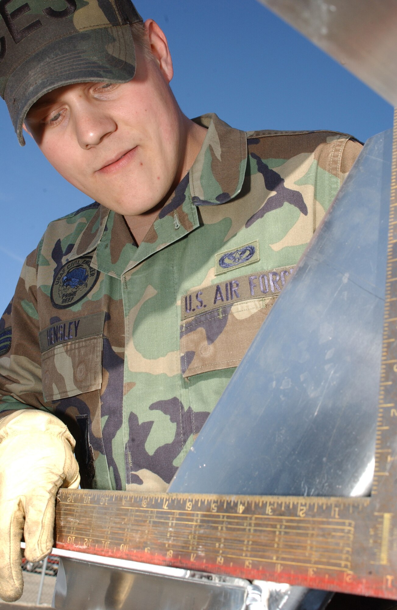 EIELSON AIR FORCE BASE, Alaska -- Senior Airman Joe Hensley, 354th Civil Engineer Squadron, checks the stair frame on a halfpipe to ensure its safety on May 01. Airman Hensley is constructing the stairs section of a halfpipe for the youth center in efforts to improve quality of life on base. (U.S. Air Force photo by Airman 1st Class Jonathan Snyder) 