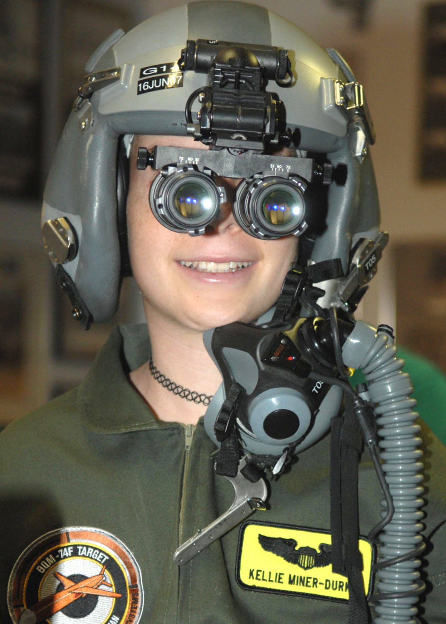 Kellie Miner-Durkit, Davis-Monthan's honorary Pilot for a Day, tries on night vision goggles at the 358th Fighter Squadron here April 27. The Pilot for a Day program is designed to find children with serious illnesses and help them enjoy a day totally devoted to them and their interest in aviation. 
