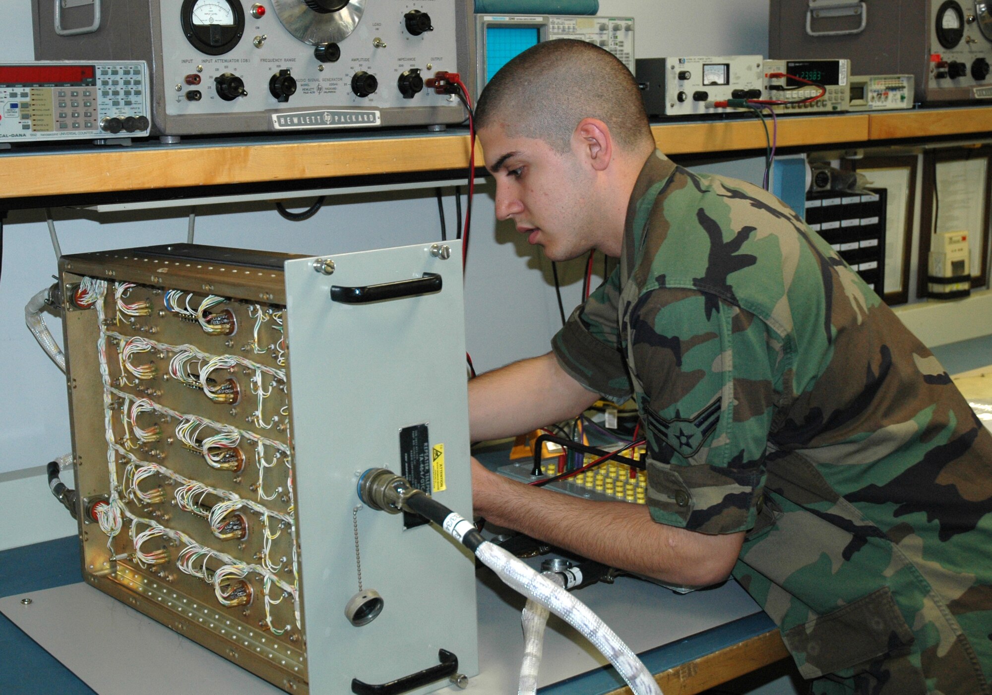 MINOT AIR FORCE BASE, N.D. -- Airman 1st Class Calvin Brown, 91st Maintenance Group, troubleshoots a missile communications drawer at the strategic communications maintenance center here April 30. Airman Brown, formerly a member of the 5th Communications Squadron here, is one of 57 missile-communications Airmen undergoing a permanent change of assignment to the 91st Space Wing. (U.S. Air Force photo by Airman 1st Class Wesley Wright)