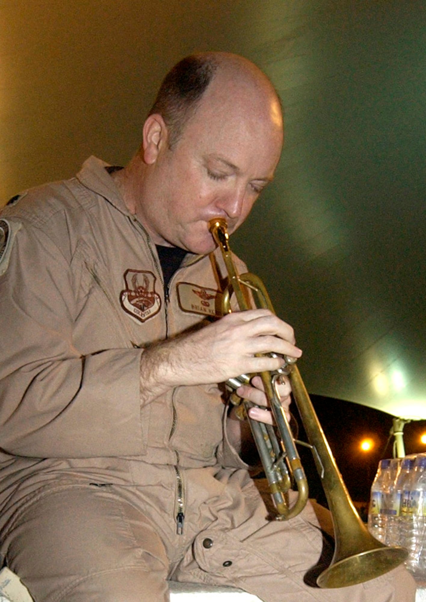 Lt. Col. Brian Reno practices his trumpet before performing in a talent show in a deployed location in Southwest Asia. The colonel is always ready to play a tune any time for deployed servicemembers. Colonel Reno is the chief of mobility operations for the Combined Air Operation Center and is deployed from Scott Air Force Base, Ill. (U.S. Air Force photo/Staff Sgt. Matthew McGovern)                    